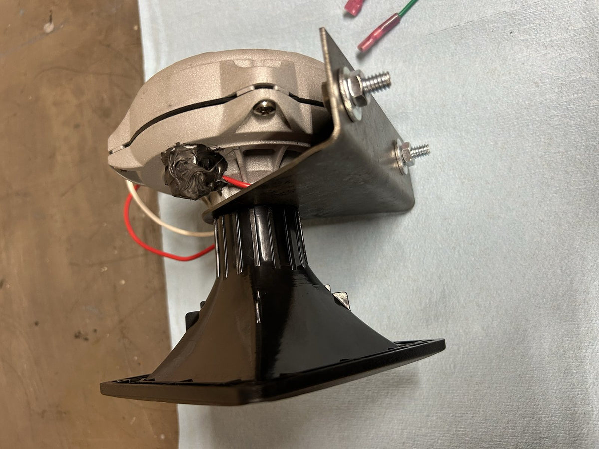 Driver mounted through the bracket with the horn flare threaded on